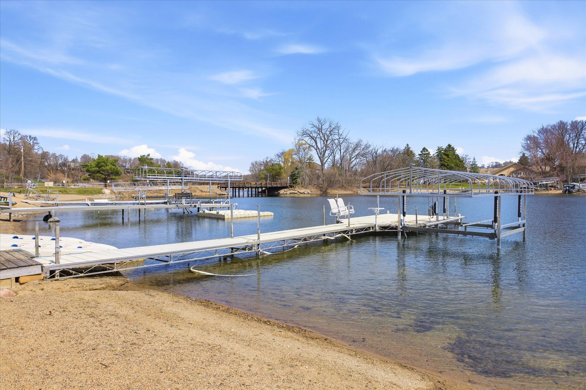 Private dock with boat lift, offering direct access to the lake and ideal for waterfront living.