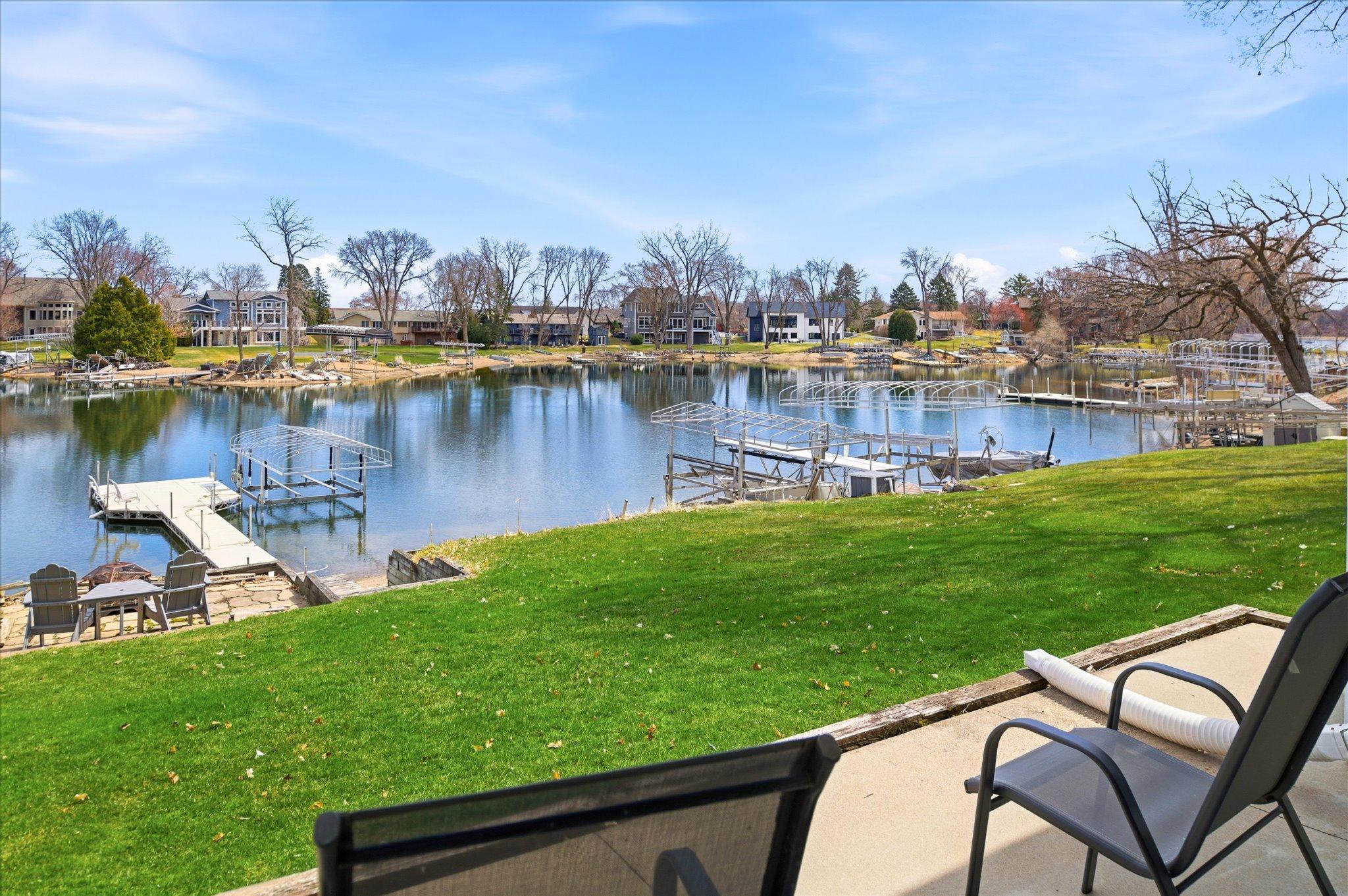 Scenic lakefront with calm waters and surrounding shoreline, perfect for relaxation and recreation.