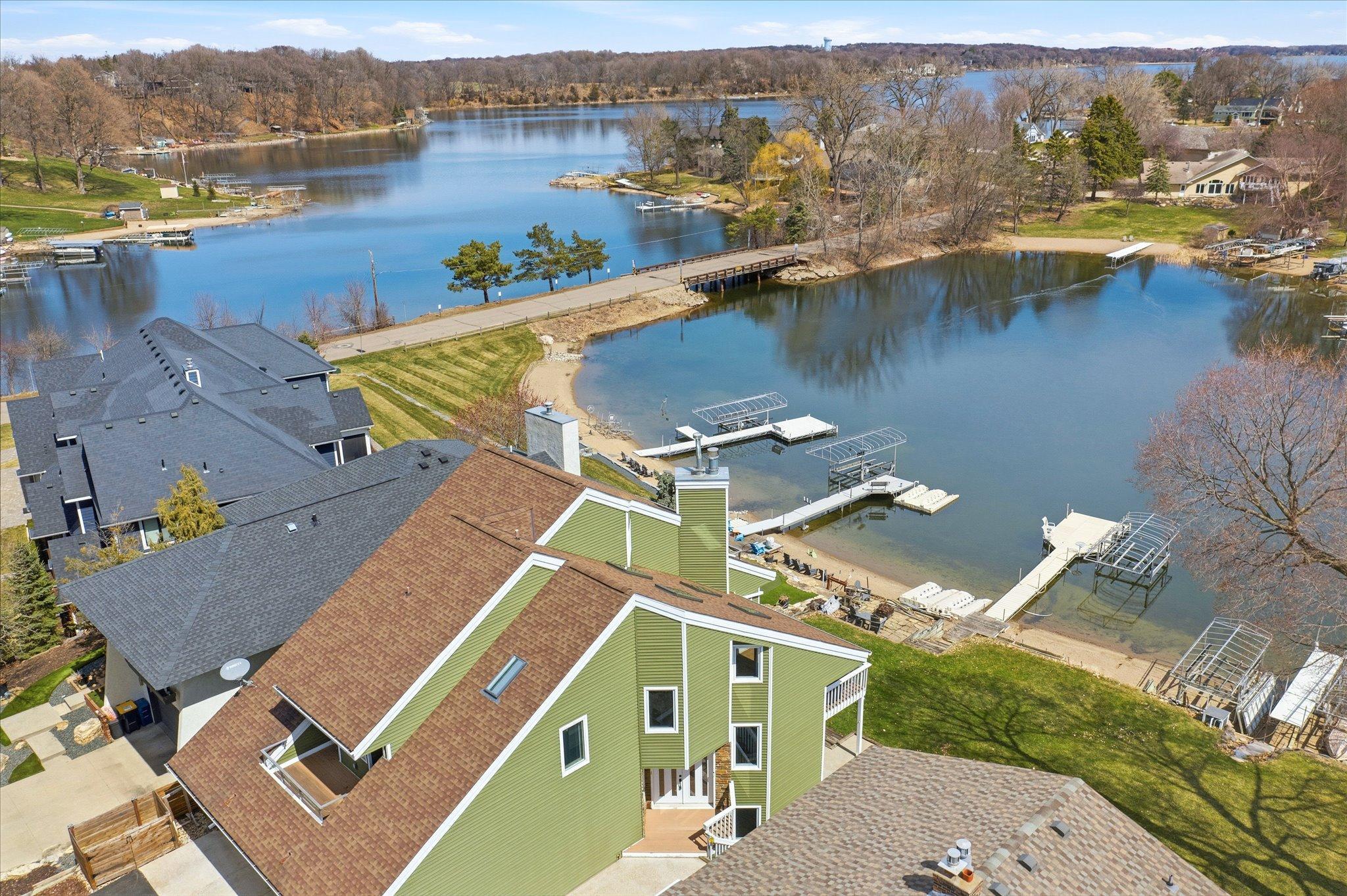 Aerial overview of shoreline, dock placement, and surrounding properties.