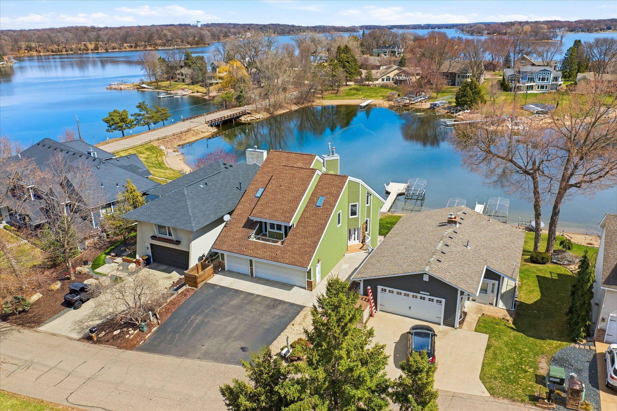 Aerial view showcasing proximity to the lake and surrounding neighborhood.