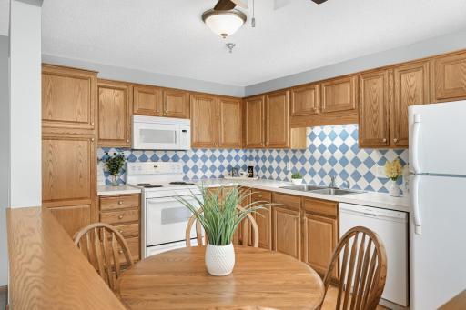 The kitchen is functional and inviting, offering ample cabinet and counter space for everyday cooking