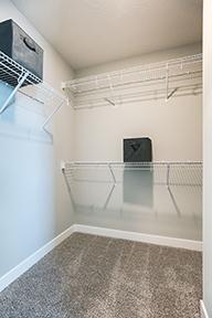 One of TWO walk-in closets in the primary suite. *Picture is of model home; actual finishes may vary.
