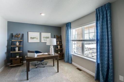The flex room, adjacent to the entryway, very spacious. *Picture is of model home; actual finishes may vary.