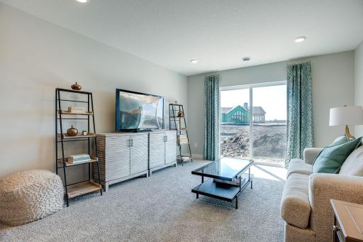 The lower level family room - comes FINISHED! *Picture is of model home; actual finishes may vary.