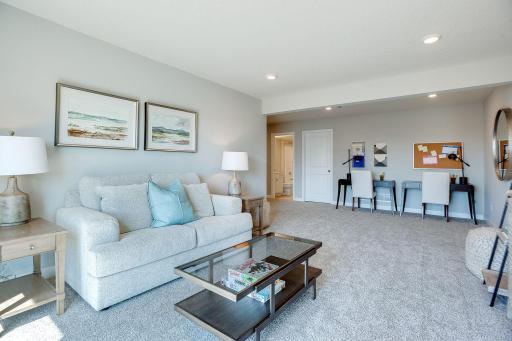 The lower level family room - comes FINISHED! *Picture is of model home; actual finishes may vary.