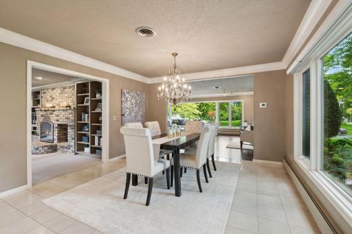 Dining room opens into living room and family room