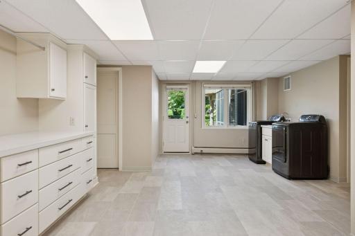 Huge laundry room with built-ins and storage