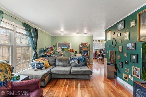 Living room into kitchen service window and dinging room