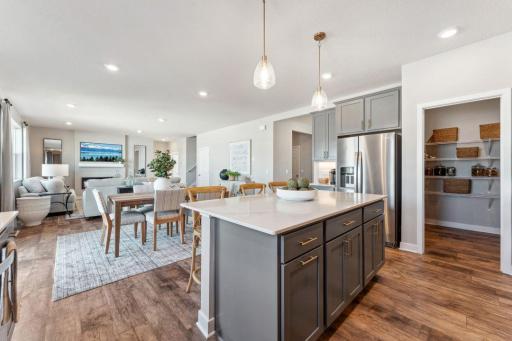 The kitchen features ample counter space with oversized subway tile backsplash.