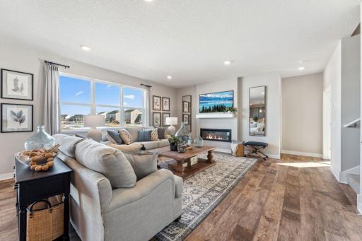 Enough room for two large couches and two pleasant chairs, this living room has ample seating for all the gatherings.