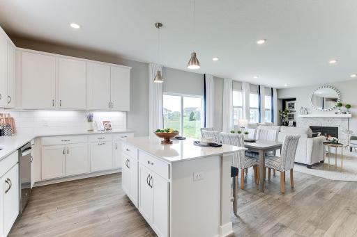 The signature kitchen in the Jordan floorplan is beautifully designed & includes quartz countertops, tile backsplash, double wall ovens & a huge walk-in pantry. Soft-close cabinets and drawers are a nice touch!