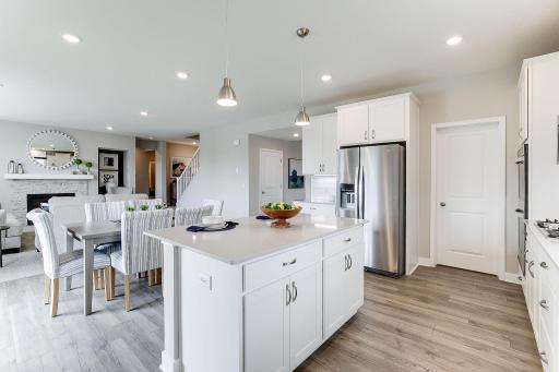 The signature kitchen in the Jordan floorplan is beautifully designed & includes quartz countertops, tile backsplash, double wall ovens & a huge walk-in pantry. The kitchen is a chef's dream & provides ample space for your culinary needs.