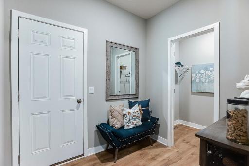 Plenty of storage space in this mud room with walk-in closet.