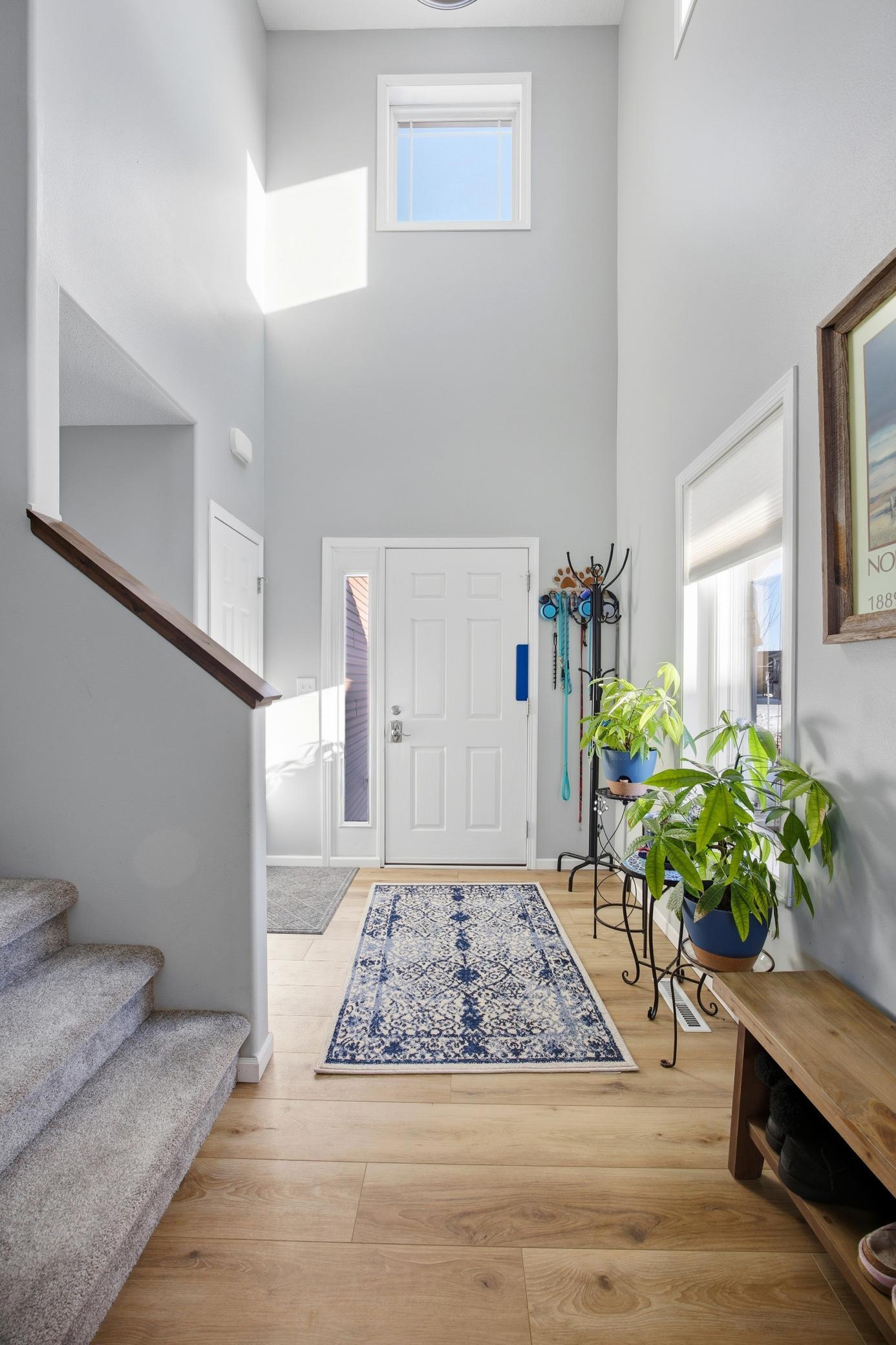 Entry- 2 stories tall with 2 windows above