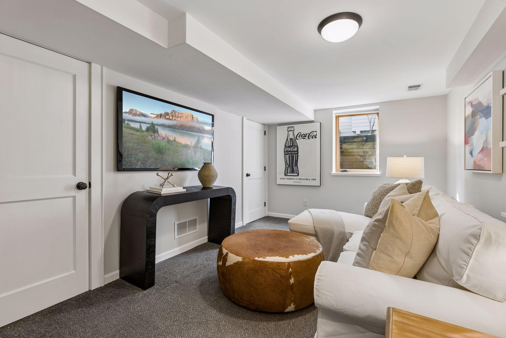 Living room in lower level has egress window