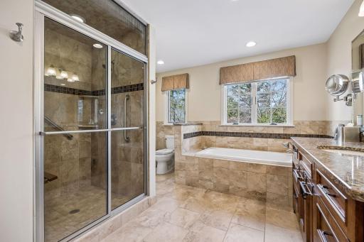 The spa-like private bathroom has a heated floor and a steam shower!