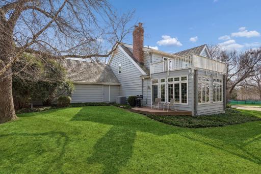 Fabulous Sunroom and composite Sundeck overlooks the private yard