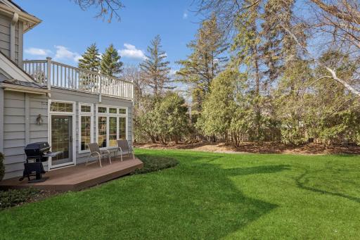 Nicely landscaped private yard with perennial plantings. Built-in gas grill included.