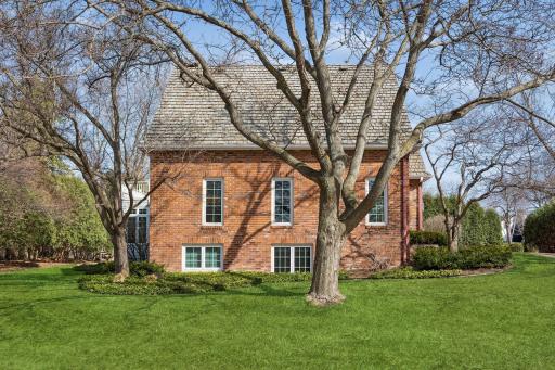 Attractive curb appeal with newer Cedar Shake Roof and Brick Exterior!