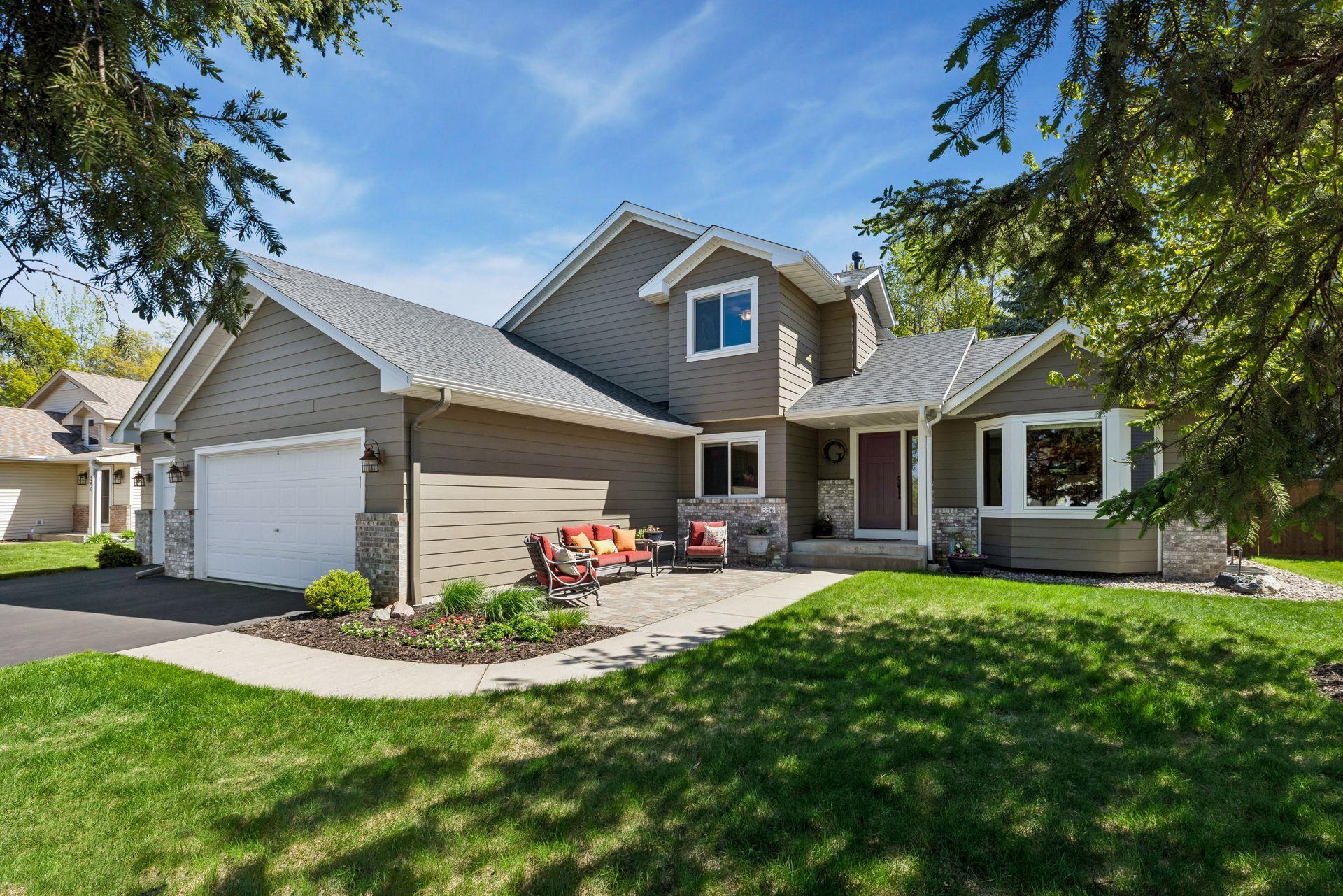 Bright exterior with inviting outdoor living spaces