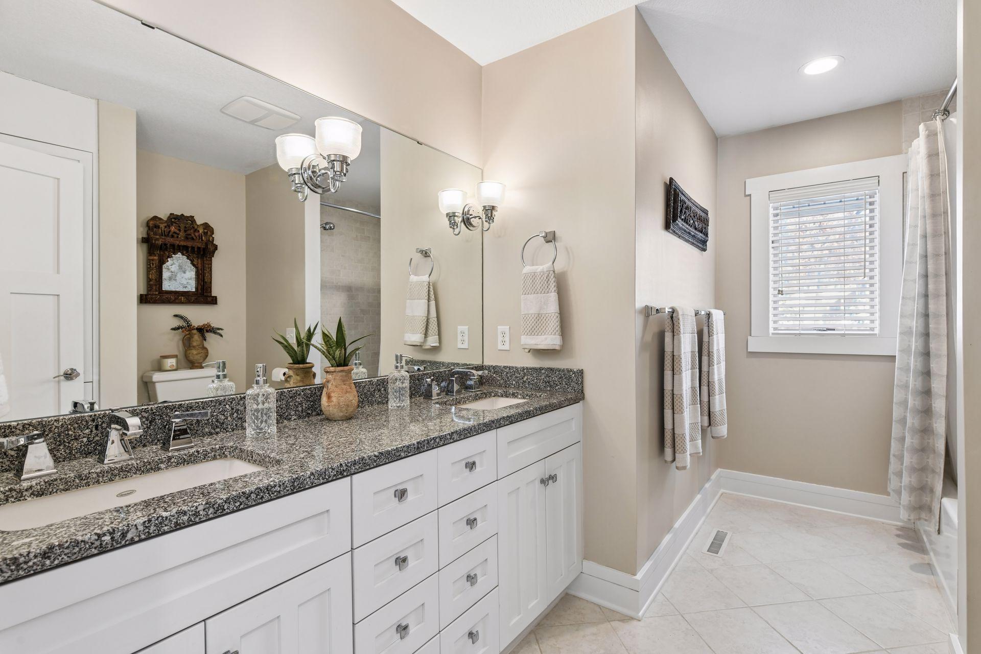 Upper level full bathroom with dual sink vanity