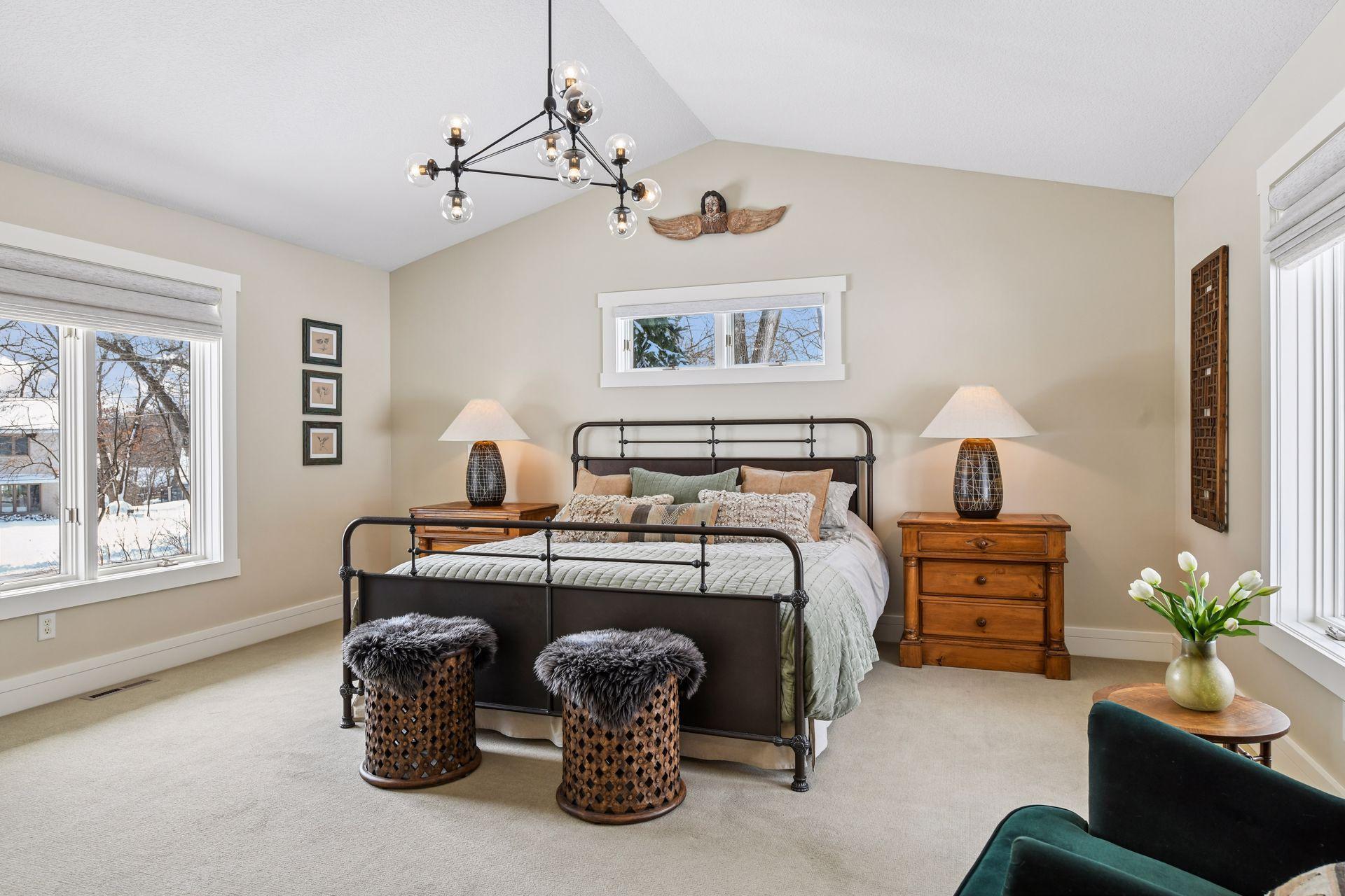 Upper level bedroom with vaulted ceilings and beautiful natural light
