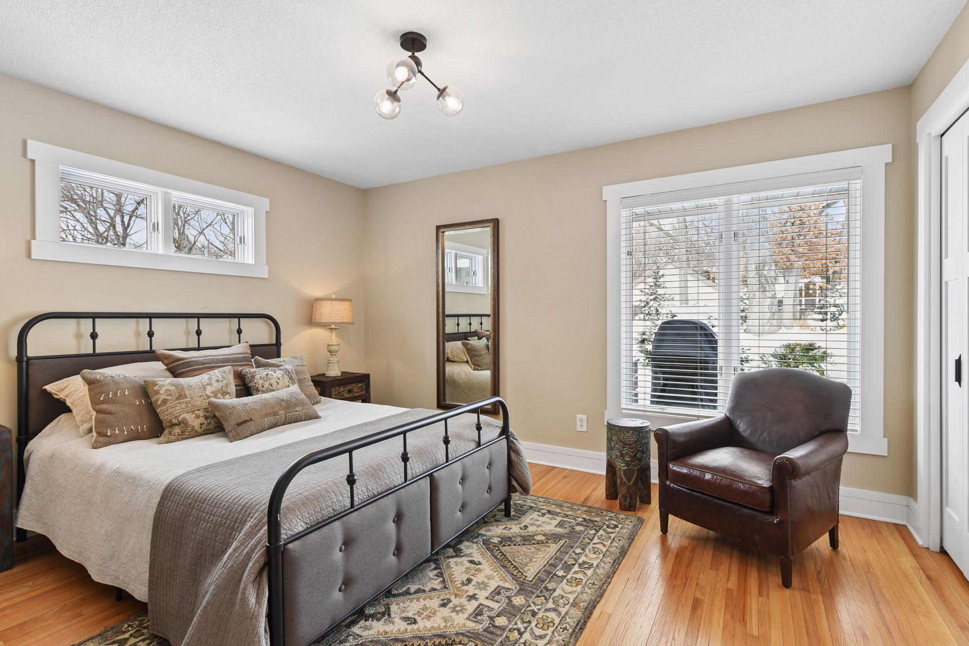 Upper level bedroom with wood floors