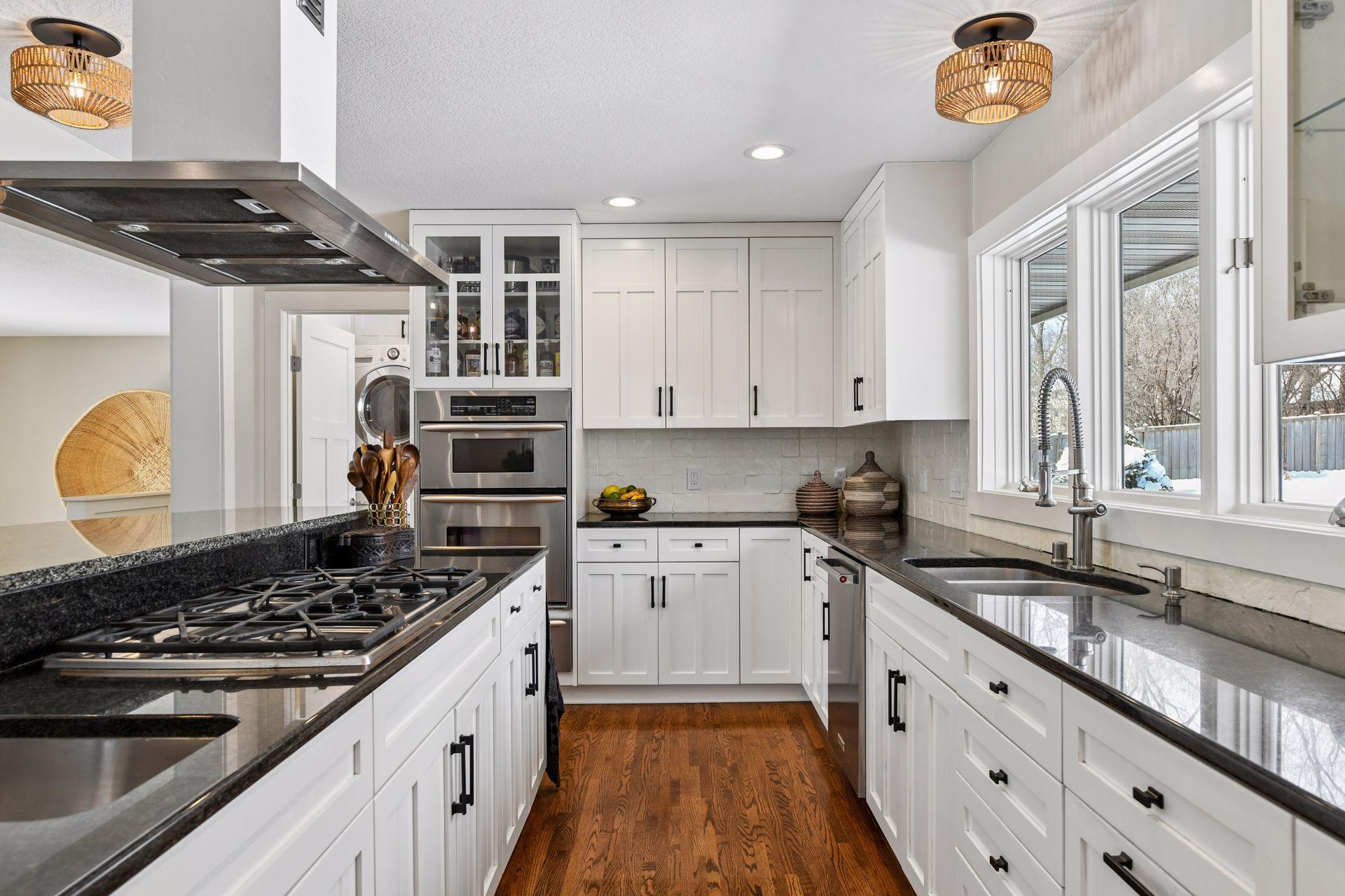The kitchen cabinets and cabinet hardware have been updated and offer plenty of storage