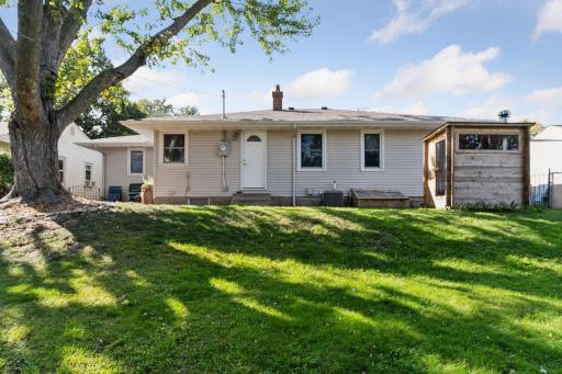 The backyard features a rolling hill that is ideal for sledding!