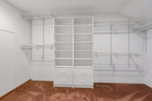 Large owner's walk-in closet with built-ins.