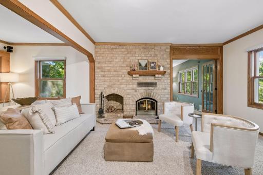 Cozy living room featuring a wood-burning fireplace, creating a warm and inviting space to relax and gather.