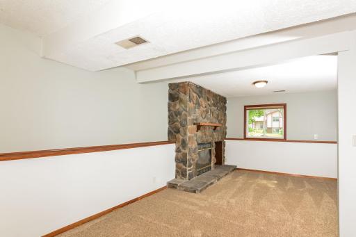 Family room with wood burning fireplace