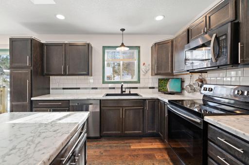 The kitchen island counter also has additional cabinet space.