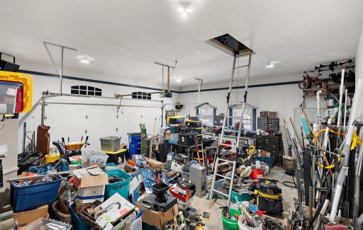 The two car attached garage is heated, insulated and features additional storage space in the upper attic accessible by ladder.