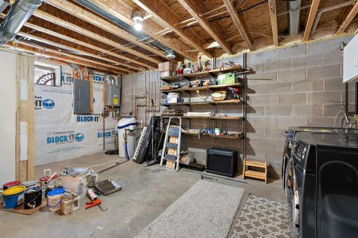 The lower level unfinished area has the home utilities and room for storage.