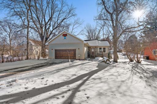 The property features an asphalt driveway and a concrete apron in front of the two stall garage. The garage is heated and insulated.