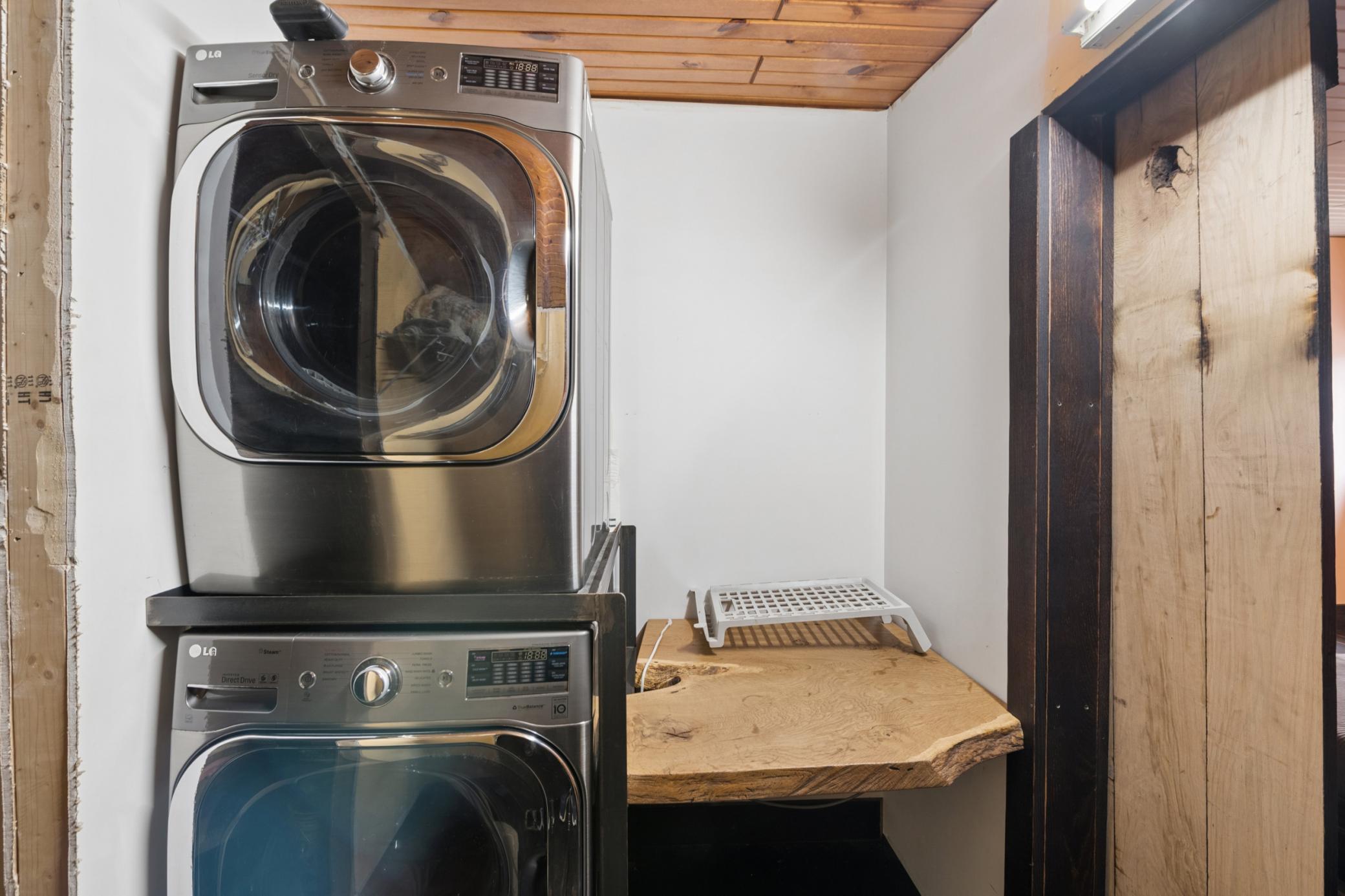 Primary bedroom in-closet laundry.