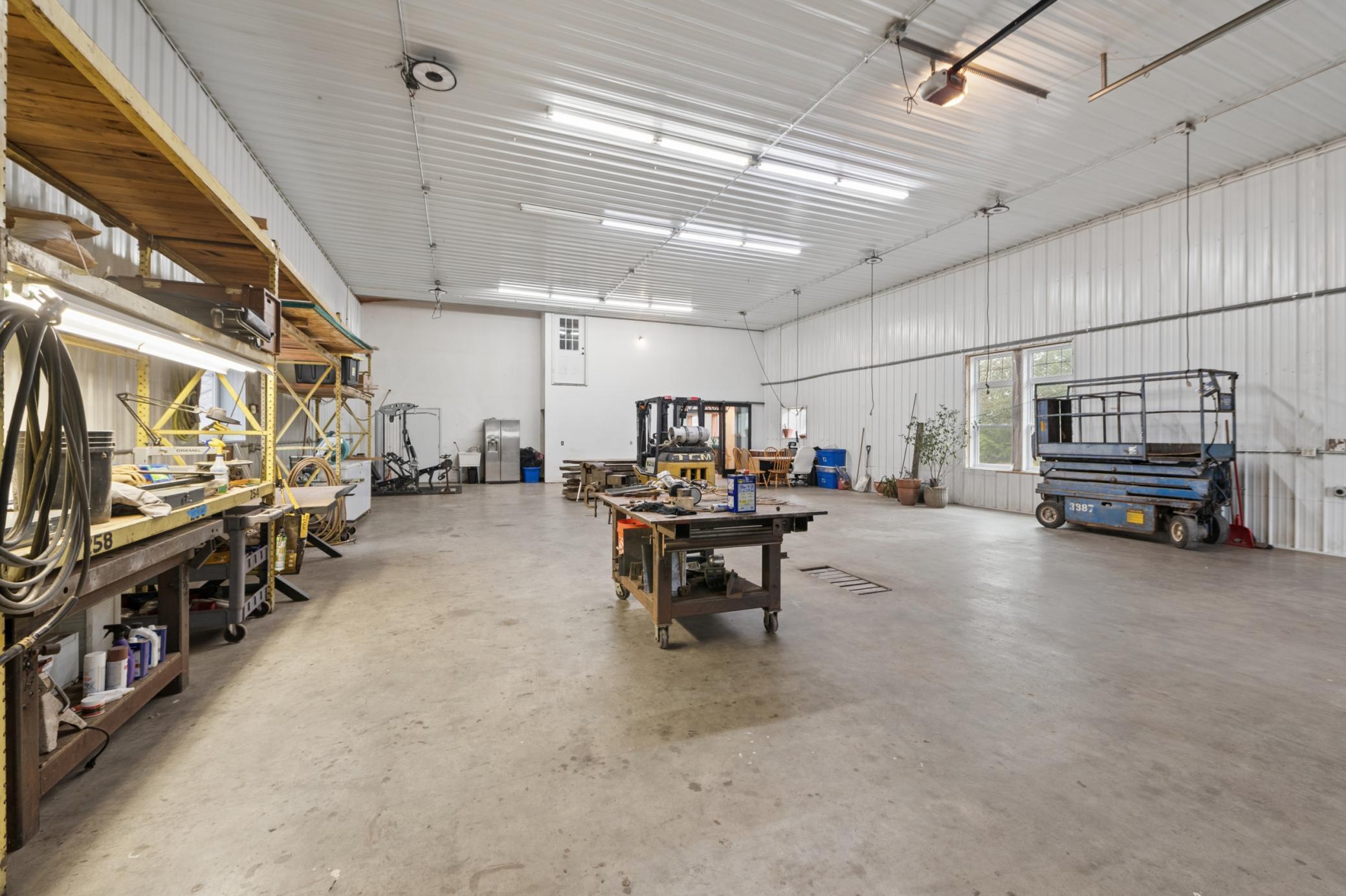 16 ft tall ceilings, heated floors, in-floor drain.