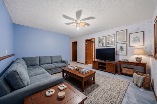 This photo of the basement family room has been virtually edited
