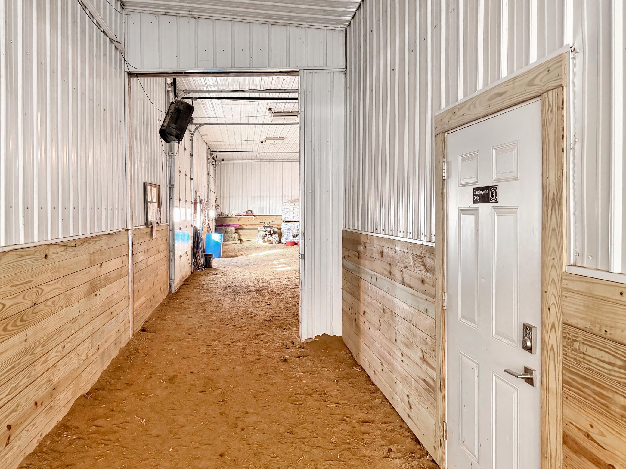Breezeway connects insulated arena to cold storage shop area