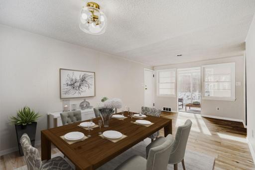 Dining area with small sun porch or mud room with sliders