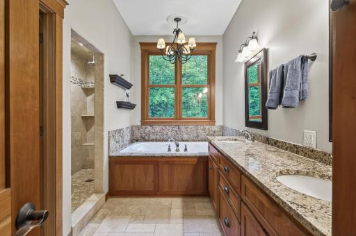 Double sinks, whirlpool bath and steam shower