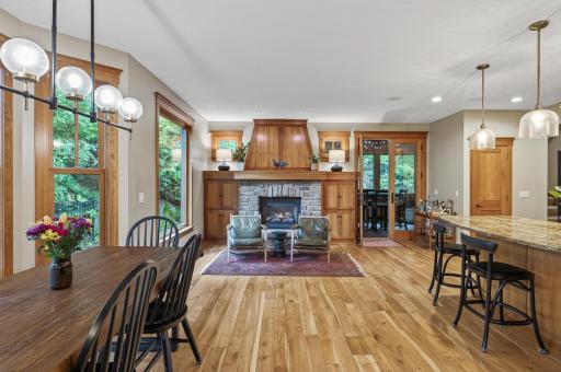 A second, cozy fireplace and screened porch perfect this space