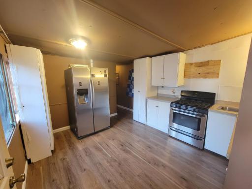 Kitchen with a dishwasher, range, microwave, and fridge/freezer!