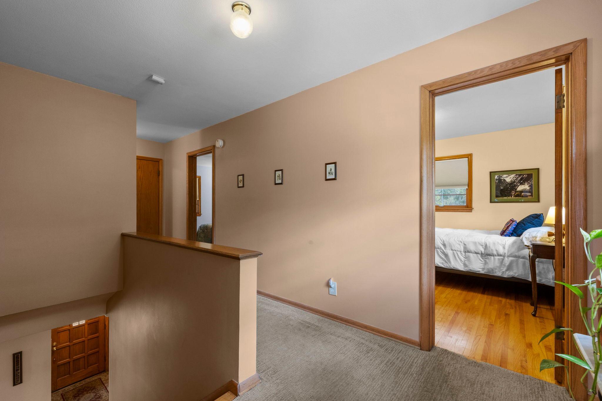Hallway leads to 4 corner bedrooms