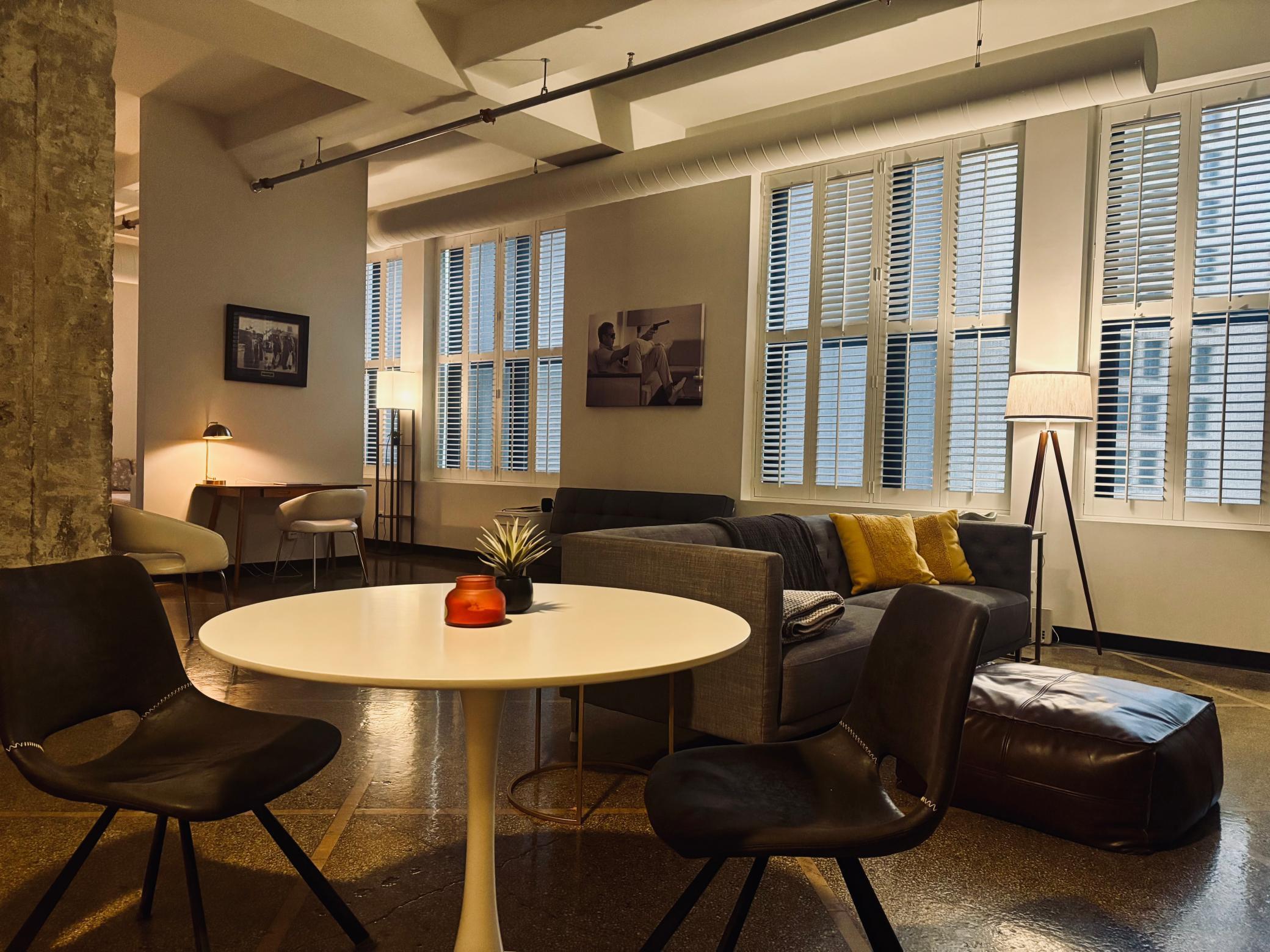 Cool urban loft-style condo with 13-foot ceilings, exxposed ductwork, one full wall of windows5.jpg