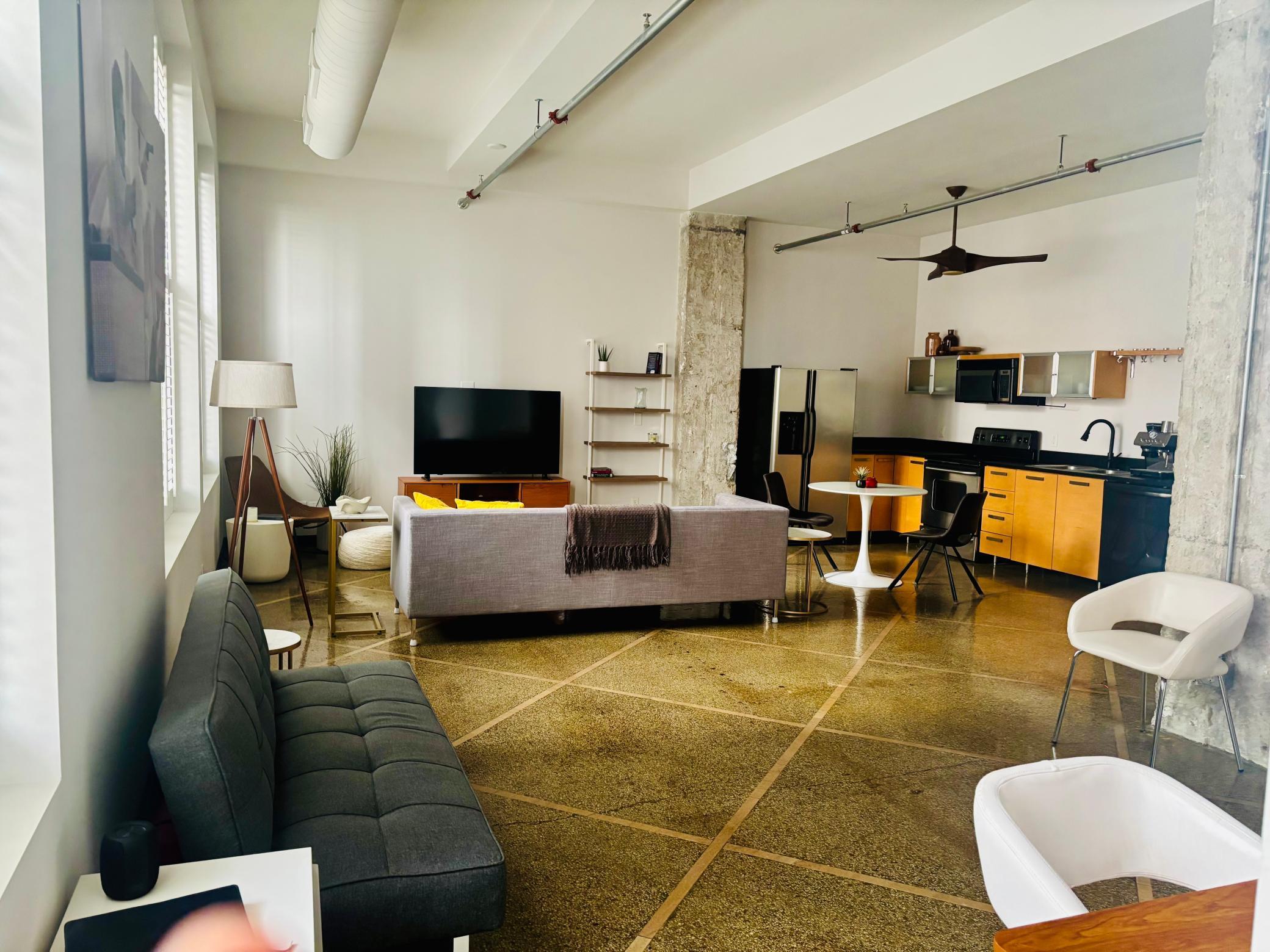 Cool urban loft-style condo with 13-foot ceilings, exxposed ductwork, one full wall of windows4.jpg