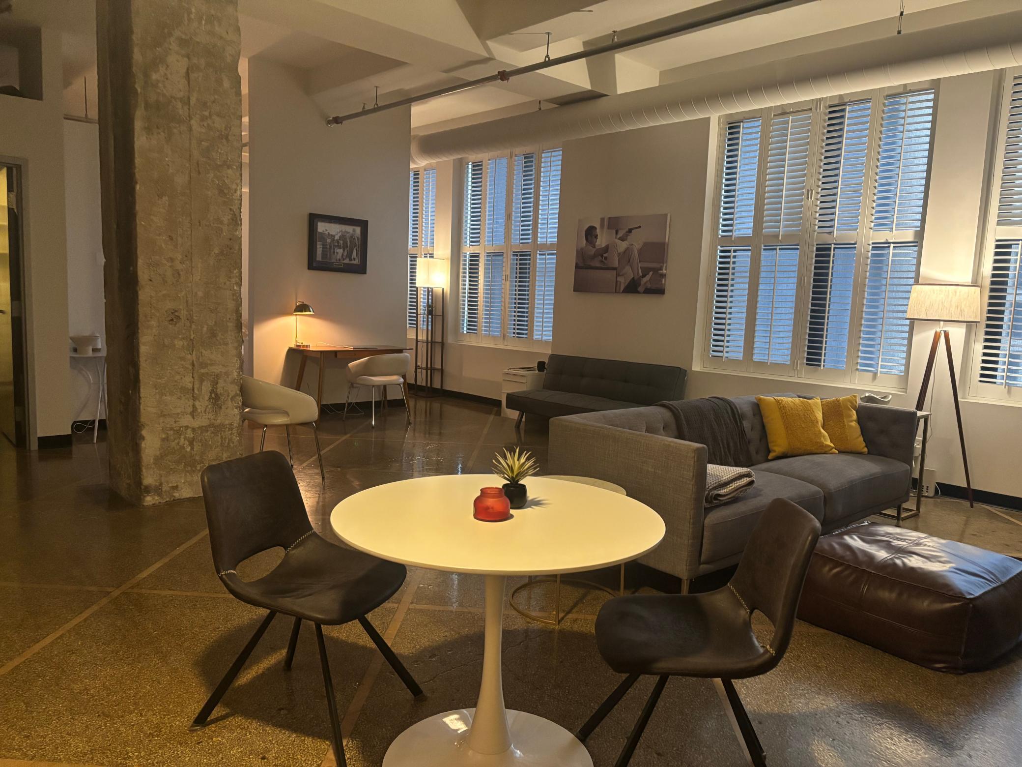 Cool urban loft-style condo with 13-foot ceilings, exxposed ductwork, one full wall of windows3.jpg