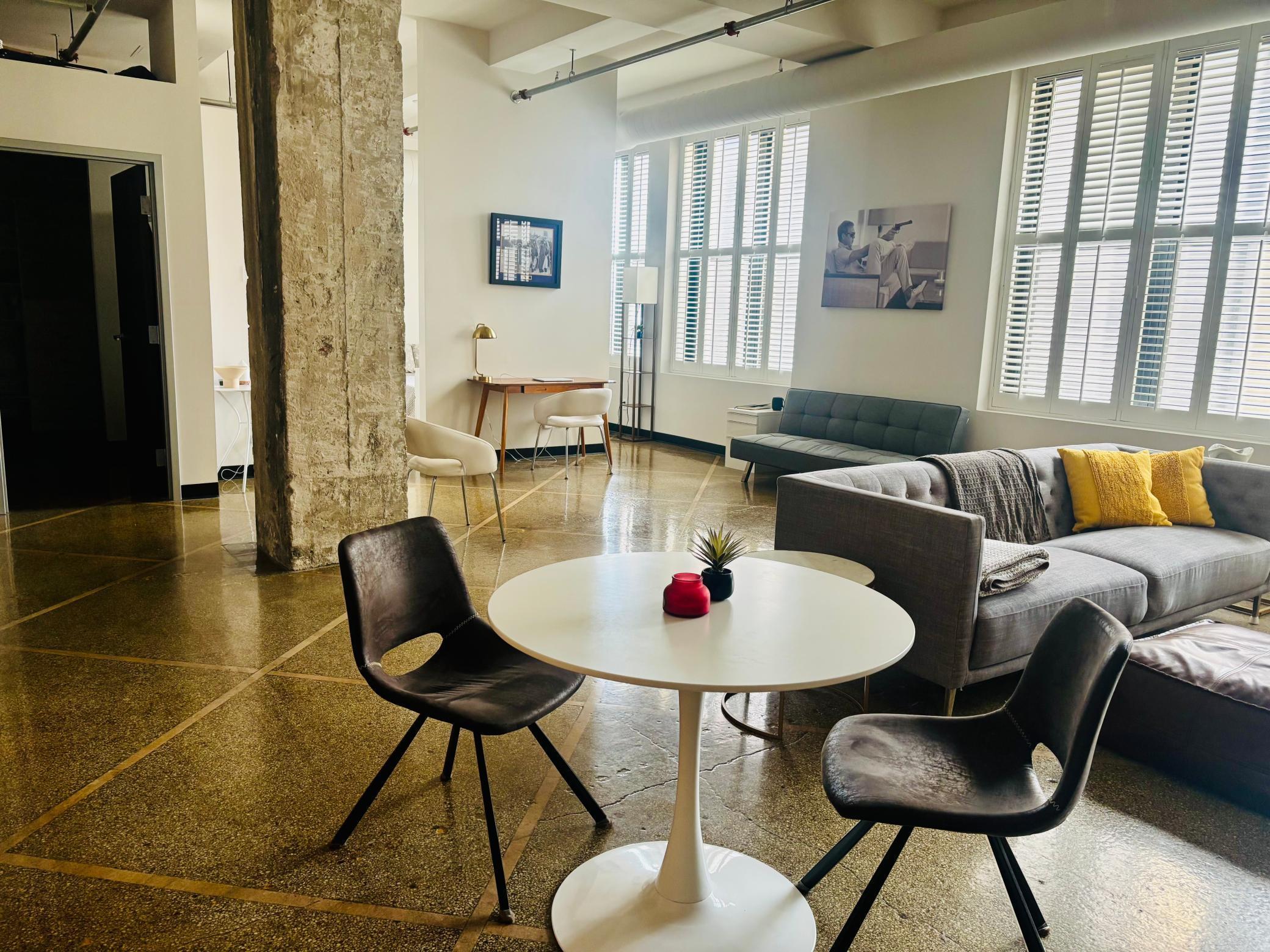 Cool urban loft-style condo with 13-foot ceilings, exxposed ductwork, one full wall of windows2.jpg