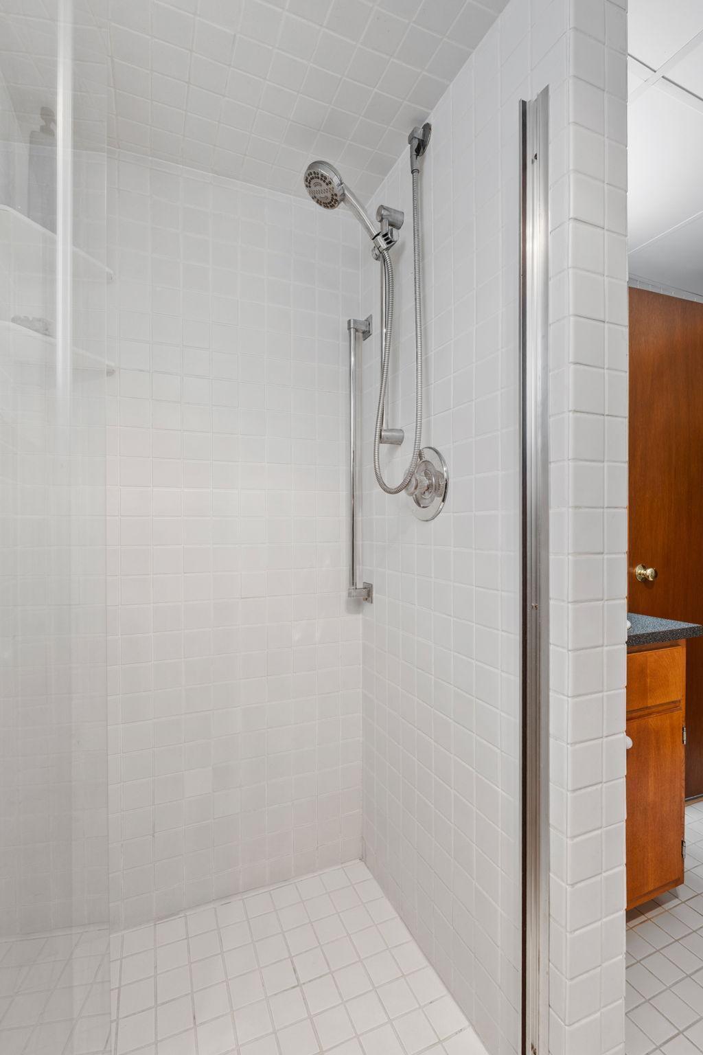 The lower level bathroom features a nice new glass shower door.